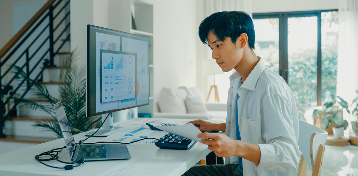 Individual viewing a desktop monitor