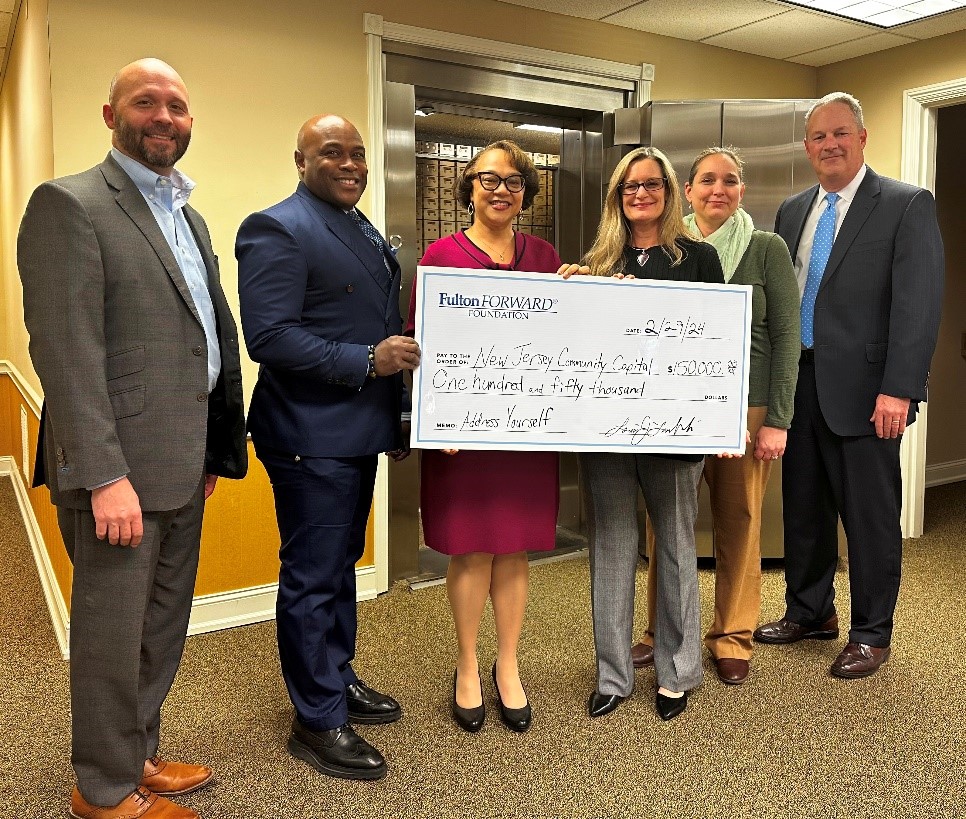 Fulton Bank donating a large check to NJCC representatives