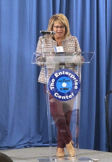 Angela speaking at the Enterprise Center